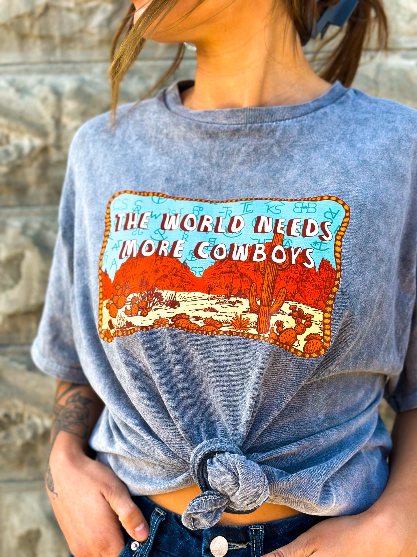 The World Needs More Cowboys Mineral Wash Tee